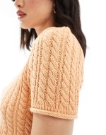 knitted cable baby tee in peach