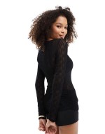 textured top with fluted sves in black