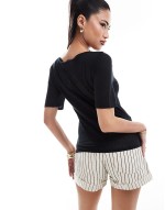 sheer jersey t-shirt in black with slash neck